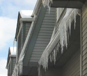 Ice Dams and Their Effect on Your Gutters and Roof - Gutter Guys